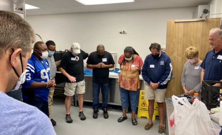 Volunteer prayer time after serving meals