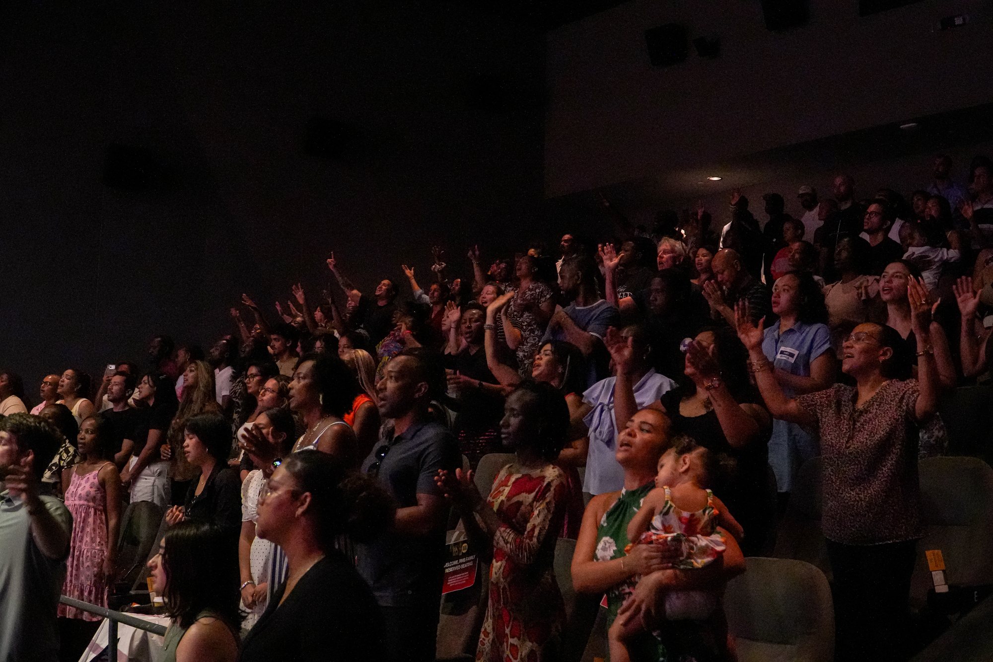 People worship together in CIAG's auditorium.