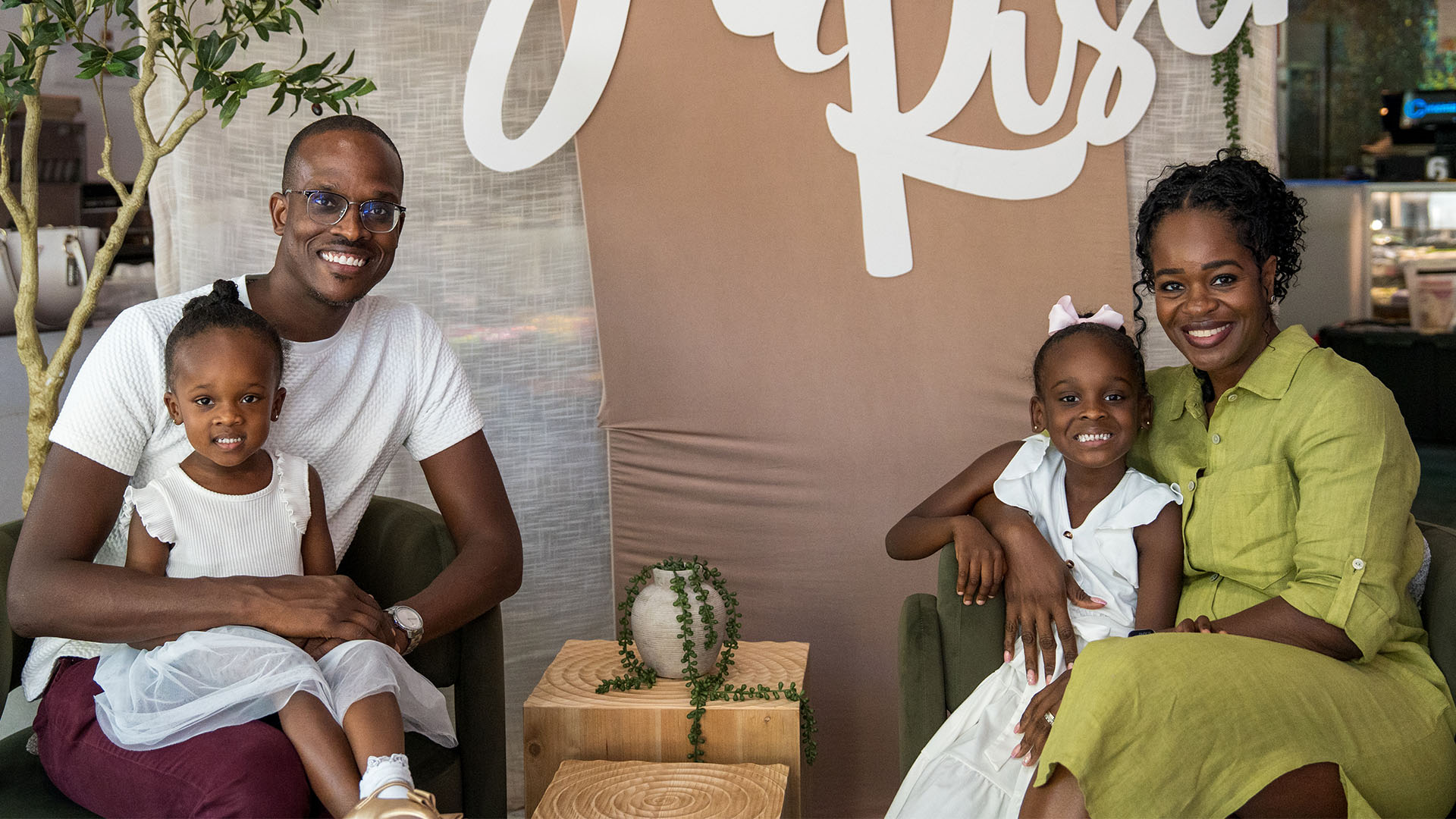 A family of four smiles together at a CIAG gathering.