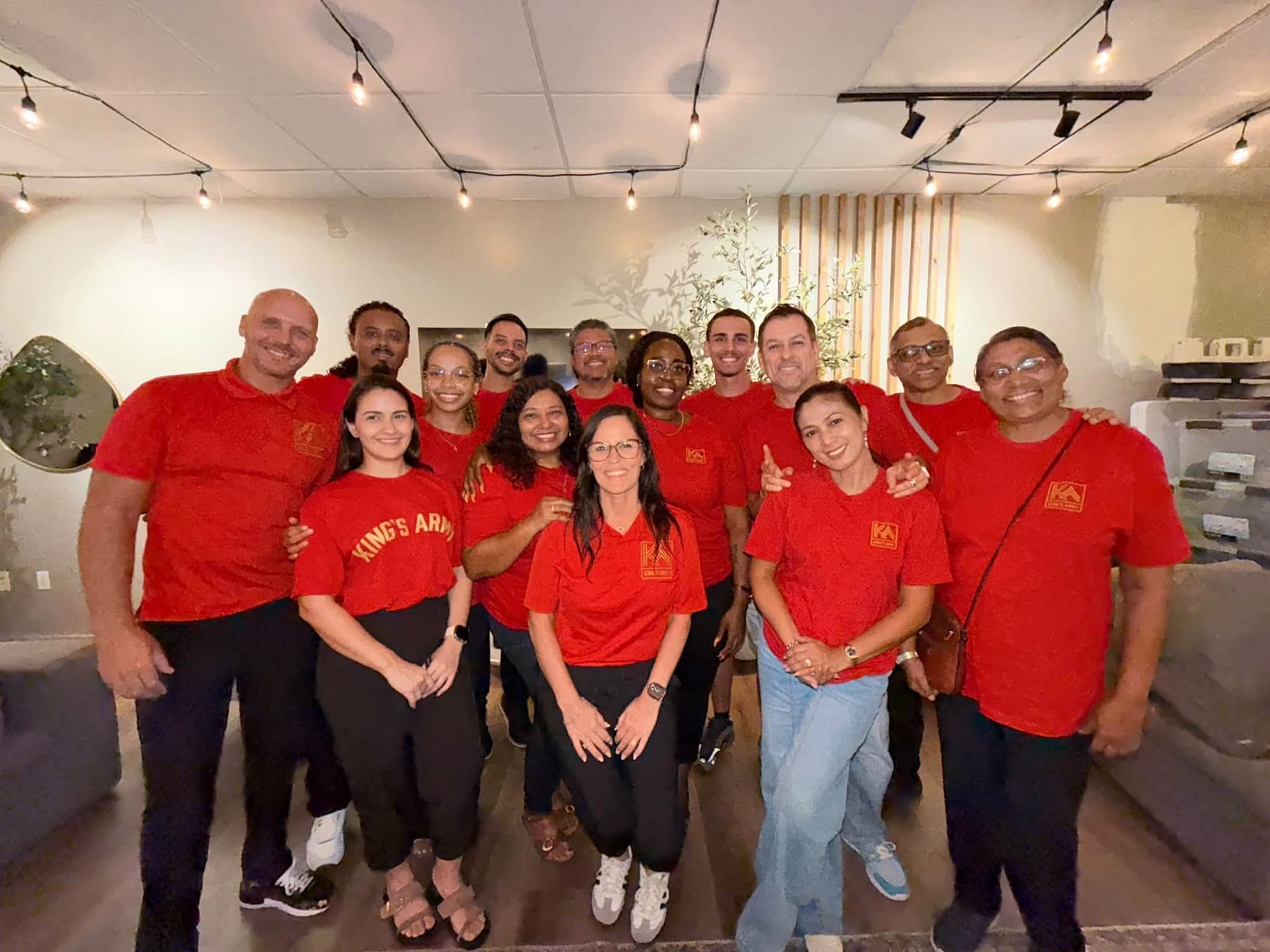 The King’s Army team gathered together in red shirts at the CIAG office.