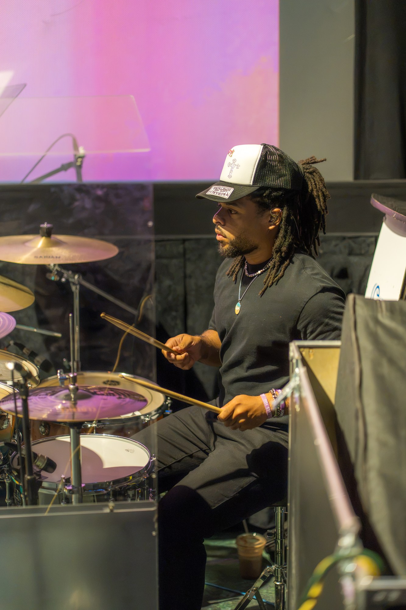 A musician plays drums during Sunday worship.