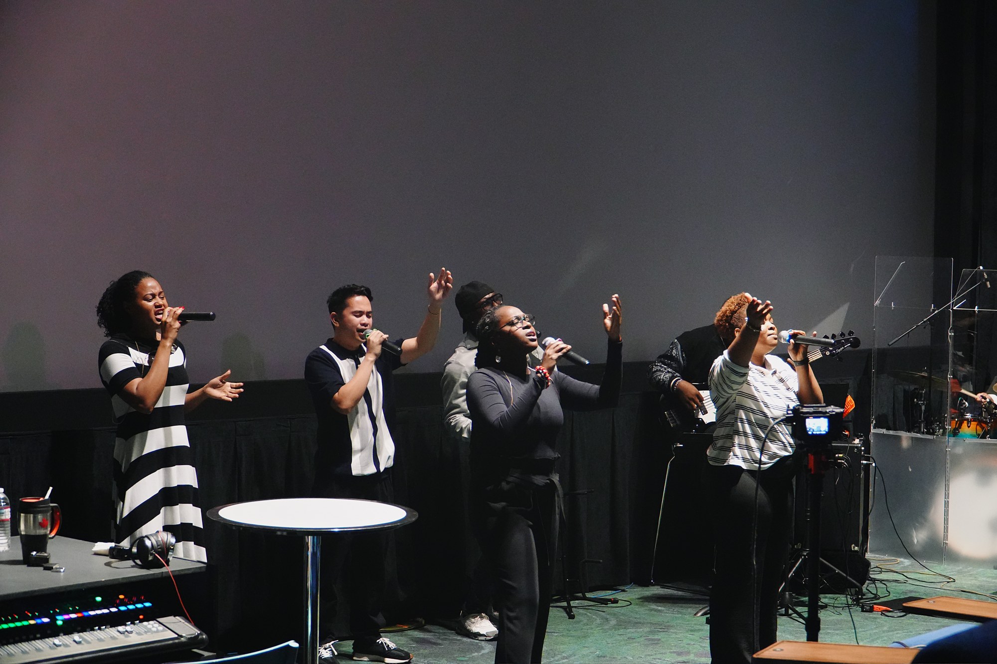 Singers lead worship from the stage.