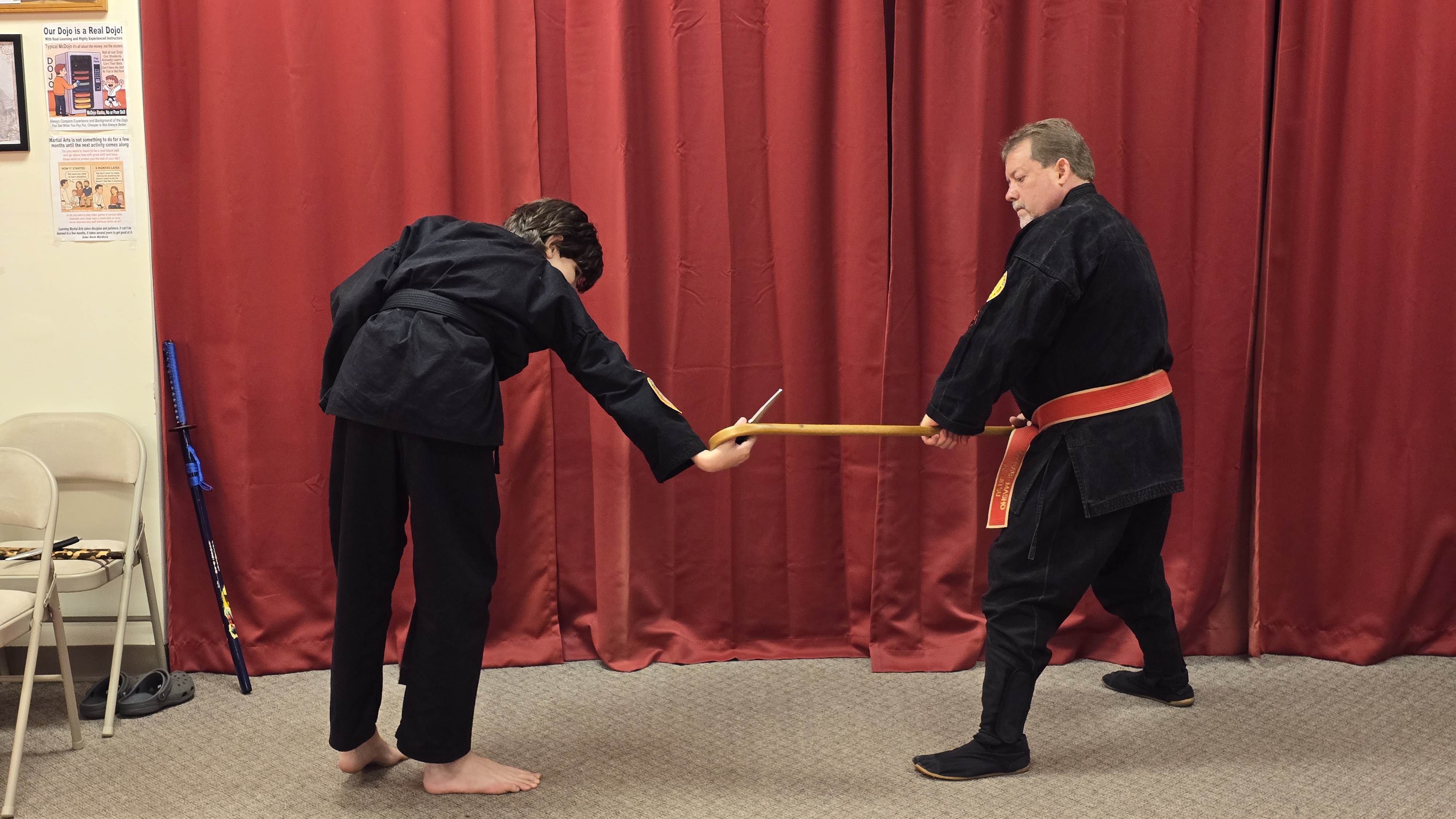 Knife disarm using a cane.