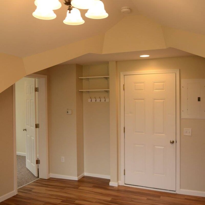 Front door, Coat Rack, and Bedroom off to the left