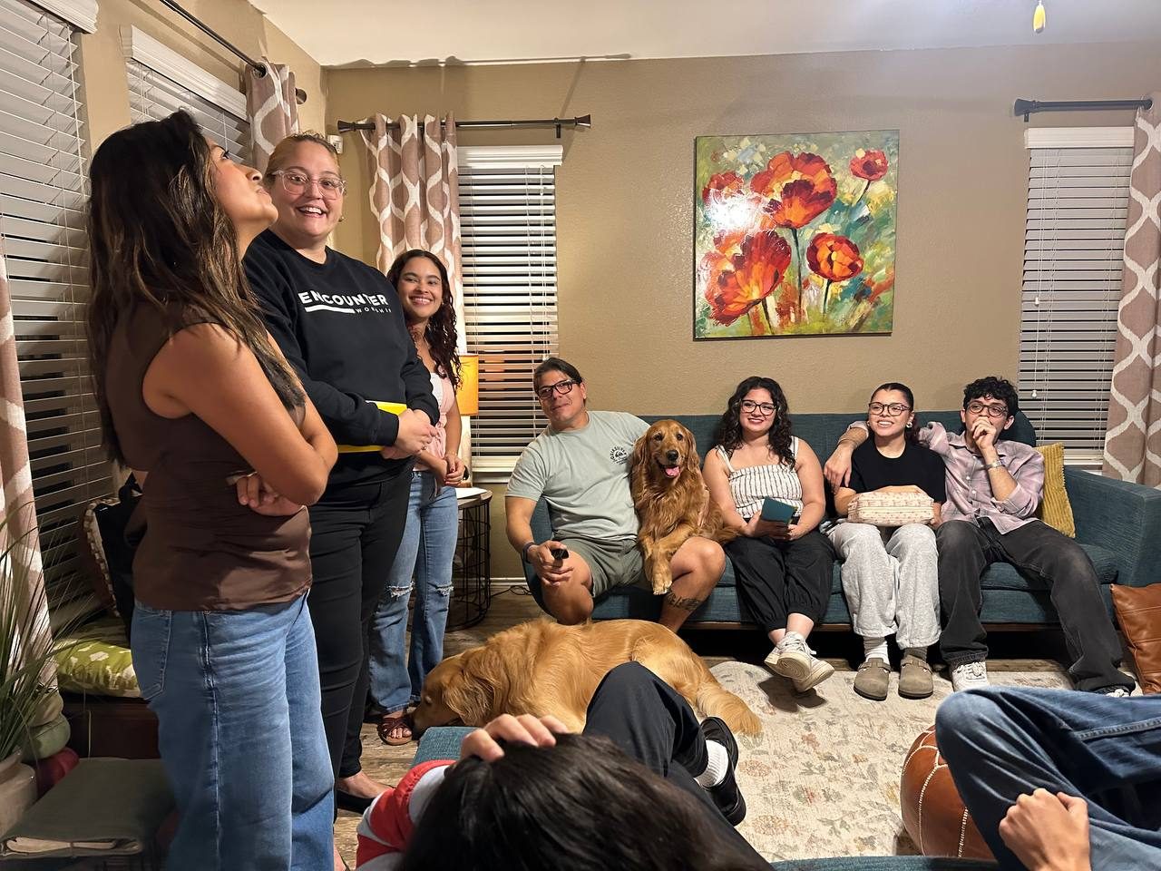 A Friday Life Group laughing together in a living room