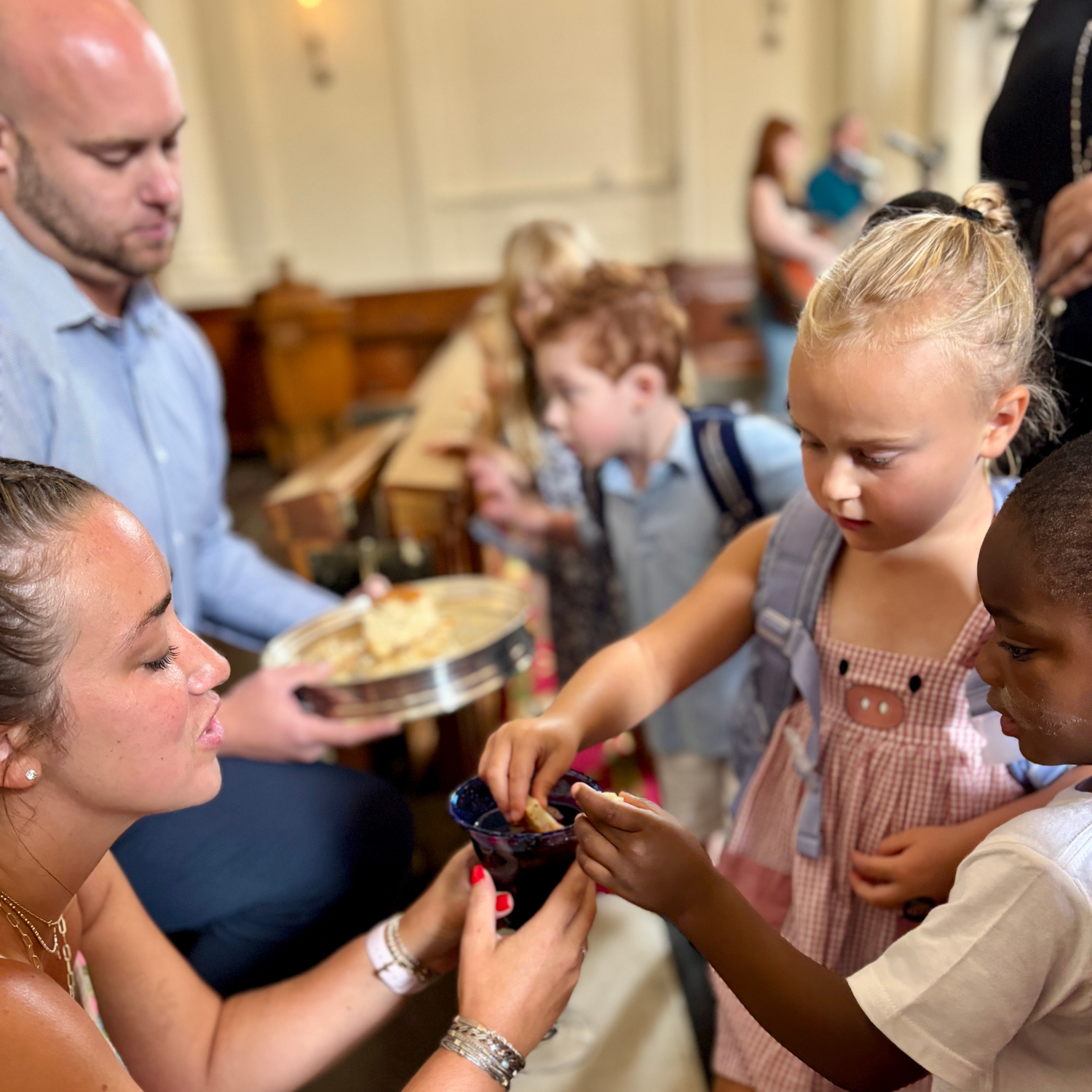 Children receiving Communion at Anniston First United Methodist Church.