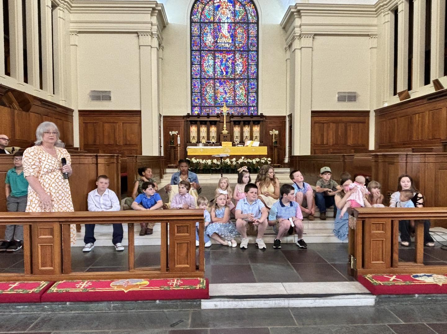 Children and adults together during the children's moment in worship.