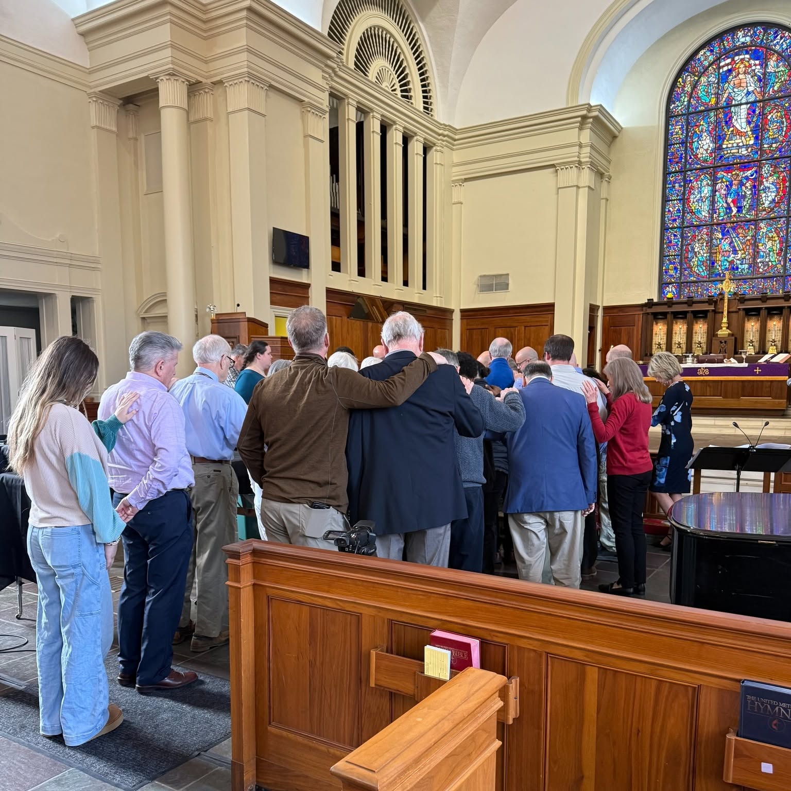 The congregation in prayer during Sunday worship.