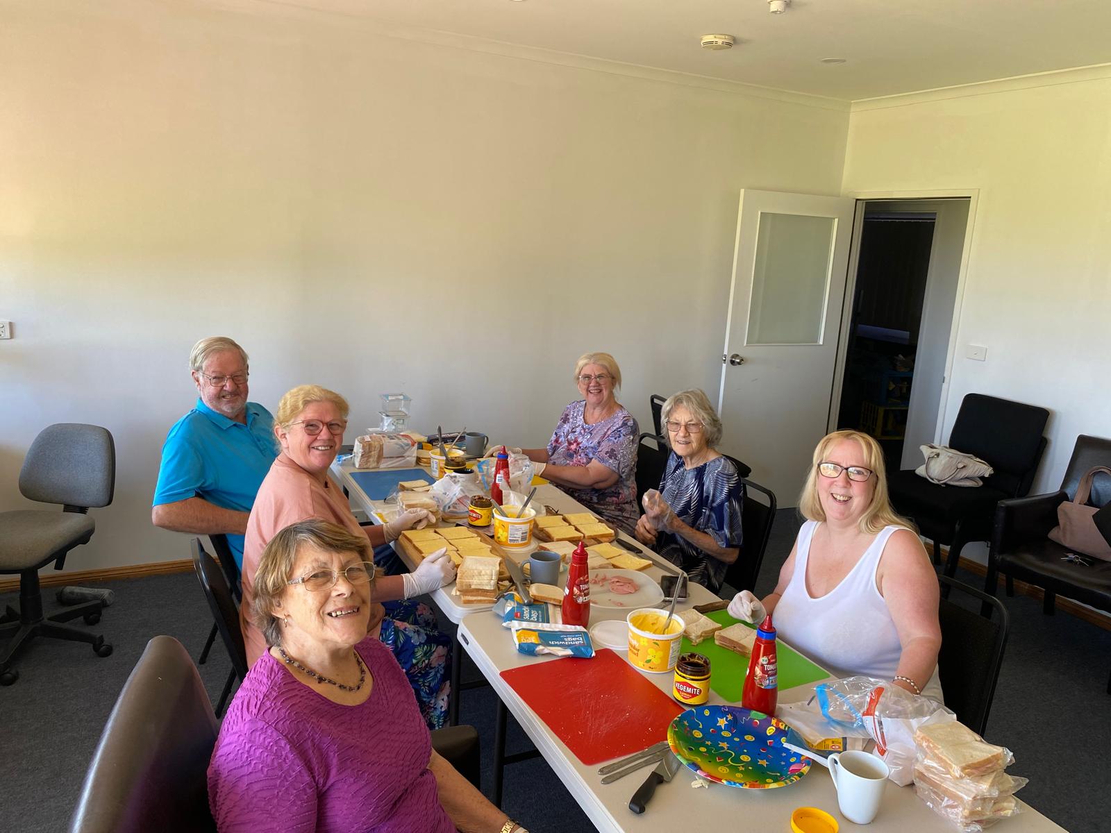 Making sandwiches for school students in need