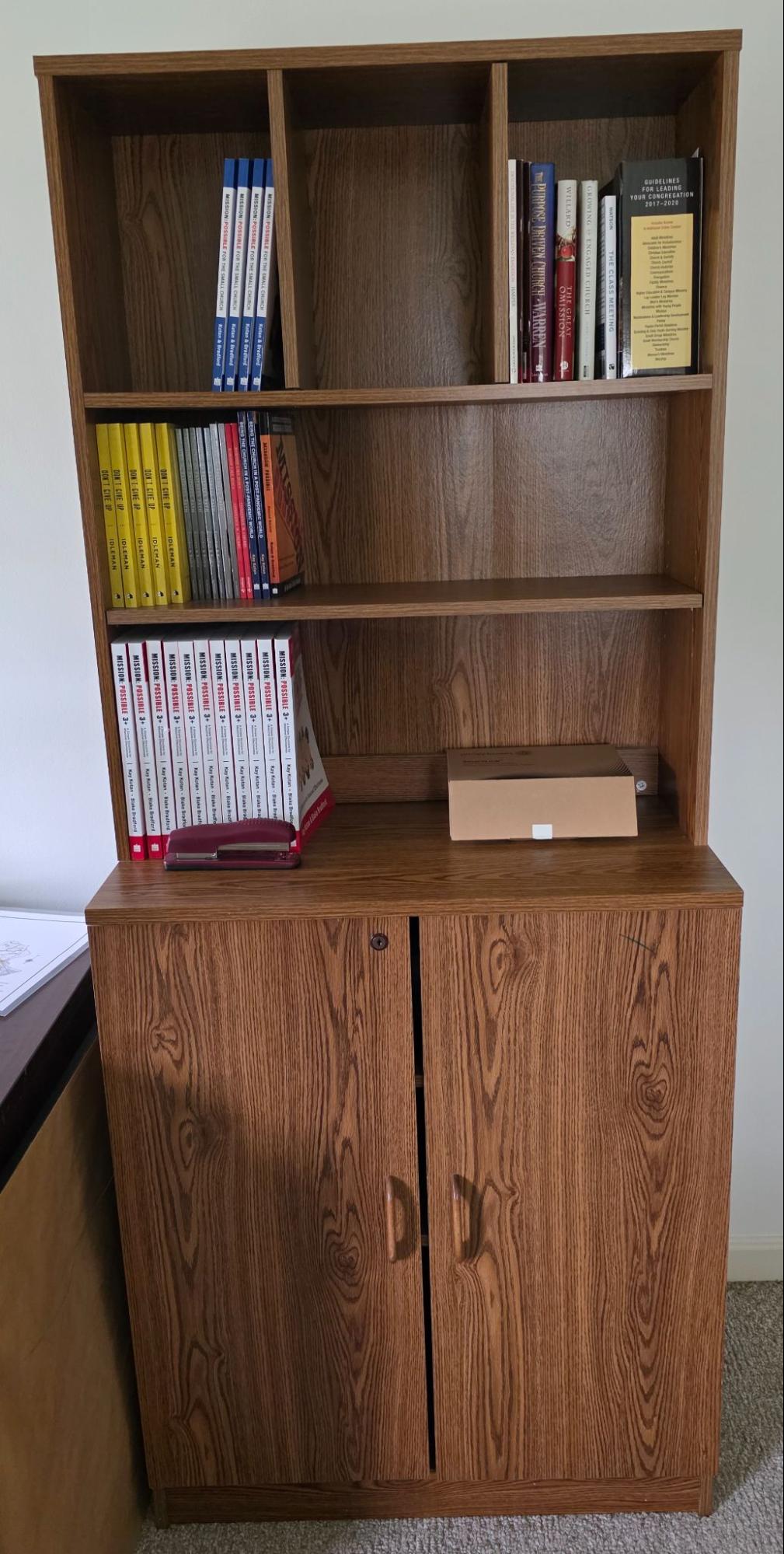 A cabinet with shelf hutch.